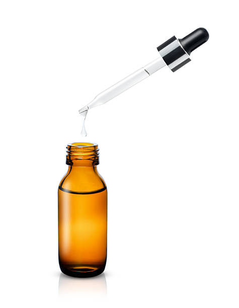 istock Essential oil in glass bottle with dropper 2205638329