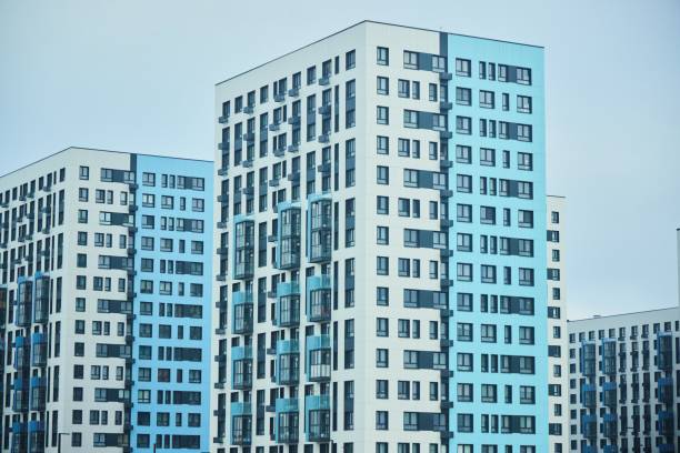 istock High-rise building, urban apartment building. Modern design 2205640212