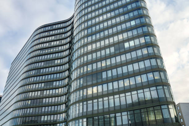 istock Modern curved office building with glass facade 2205641060