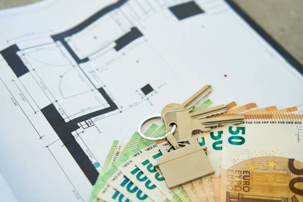 istock House keys and euro banknotes on architectural blueprint 2205641891