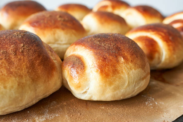 istock Freshly baked scones on baking paper, close-up. 2205641930
