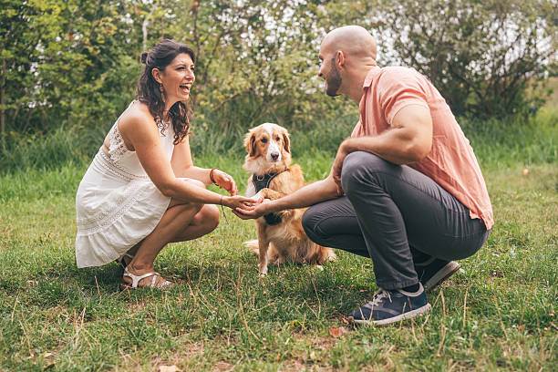 istock Couple bonding with their dog in nature 2205643102