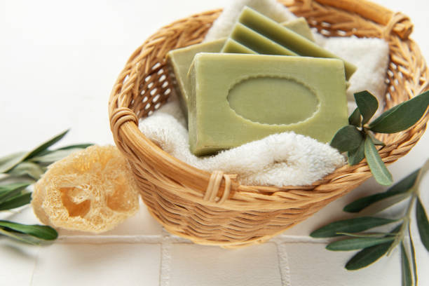 istock Olive soap bars resting on soft towel in wicker basket, embracing natural hygiene 2205643306