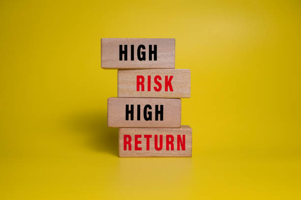 istock high risk high return words on wooden blocks isolated on yellow background 2205645778