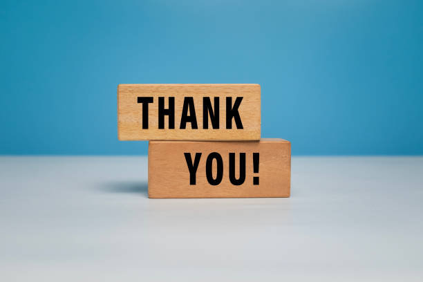 istock thank words symbol on wooden blocks isolated on grey background 2205646817