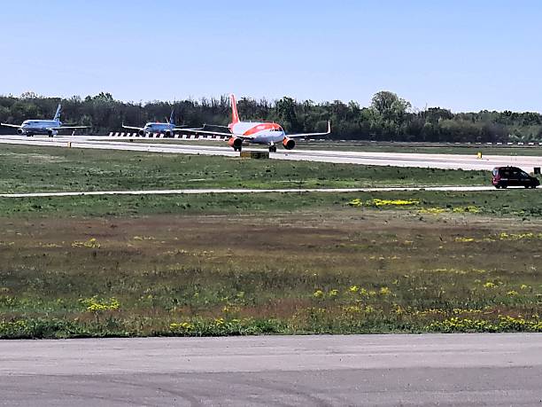 istock airplane waiting to take off on an airport runway 2205647736