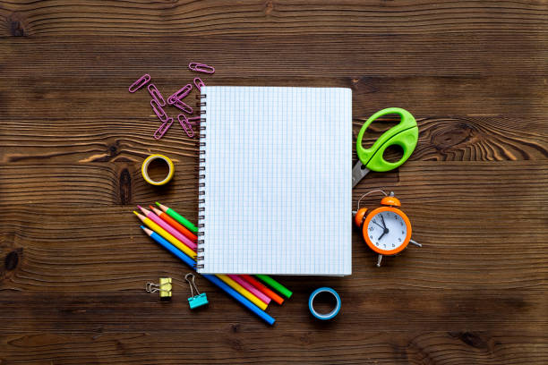 istock Blank sheet of notebook with school supplies, top view. Education concept 2205647823