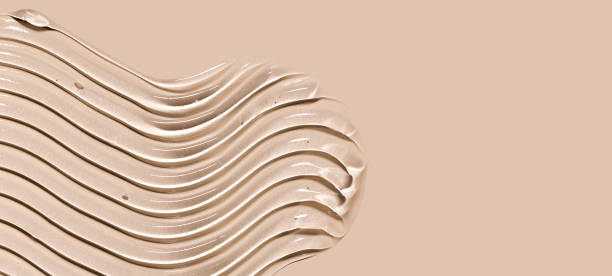 cosmetic texture gel essence smear on a beige background close-up