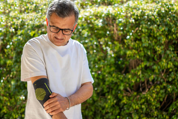 istock Bandage on elbow. First aid and medicine concept 2205654811