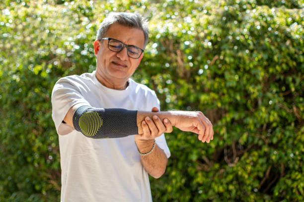 istock Bandage on elbow. First aid and medicine concept 2205654854