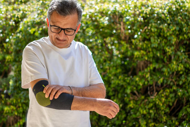 istock Bandage on elbow. First aid and medicine concept 2205654932