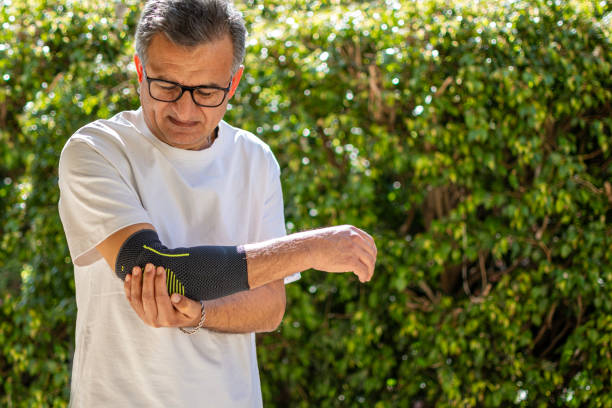 istock Bandage on elbow. First aid and medicine concept 2205655061
