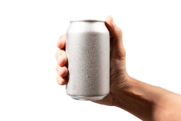 istock Male hand holding an aluminium drinking can isolated on white background 2205655163