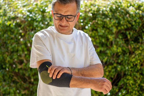 istock Bandage on elbow. First aid and medicine concept 2205655189