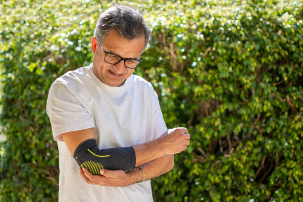 istock Bandage on elbow. First aid and medicine concept 2205655636