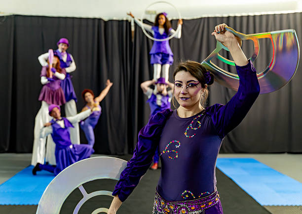 istock Circus artists performing acrobatic show in purple costumes 2205657682