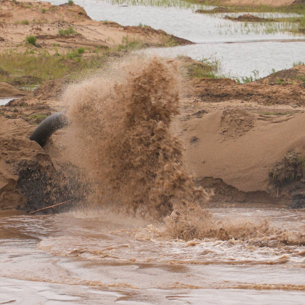 istock Dirty water is flowing from the pipe 2205657805