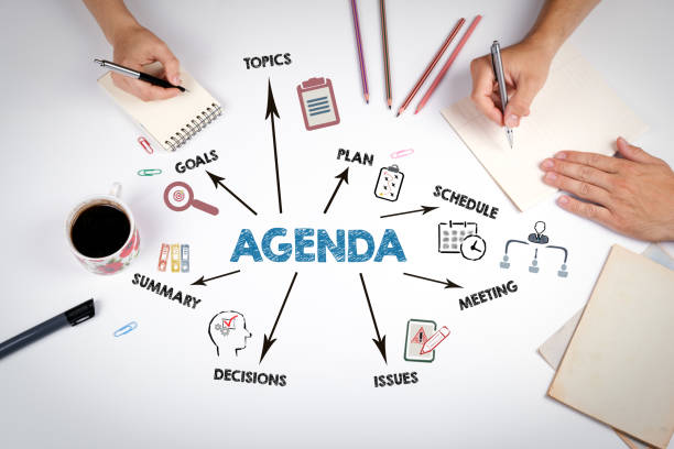 istock AGENDA Concept. The meeting at the white office table 2205660754