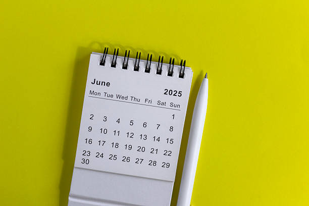 istock Hello, June 2025 desk calendar for planning on yellow background. 2205663727