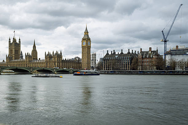 London, UK 03 11 2025 Elizabeth Tower with Big Ben seen from across the Thames on a cloudy overcast day.