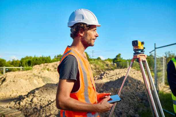 istock Engineers planning road construction using theodolite and surveying equipment 2205665814