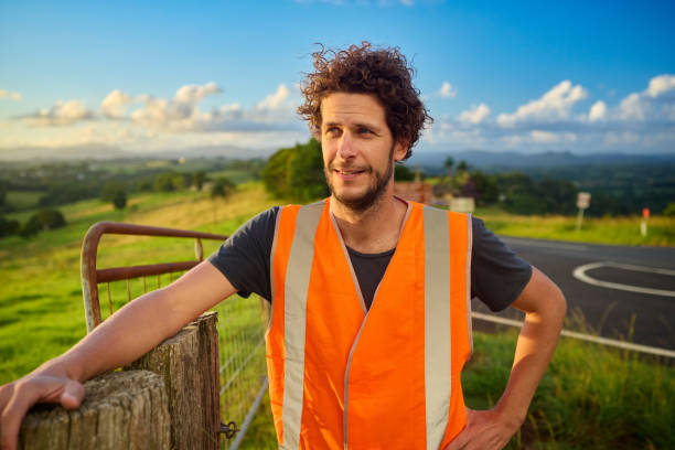 istock Engineer wearing high-visibility vest planning in the australian countryside 2205665848