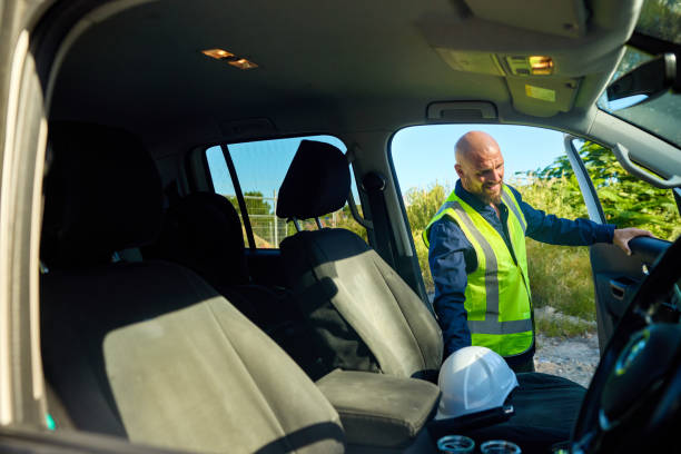 istock Construction engineer arriving at site, getting out of his car 2205665878