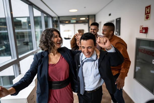 istock Coworkers celebrating on the office 2205667789