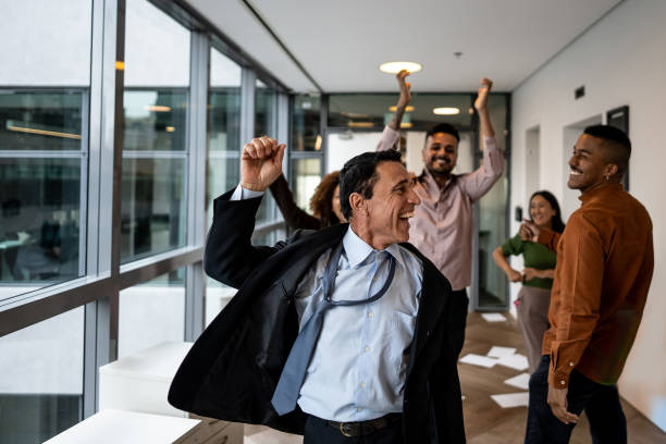 istock Businessman celebrating on the office 2205667797