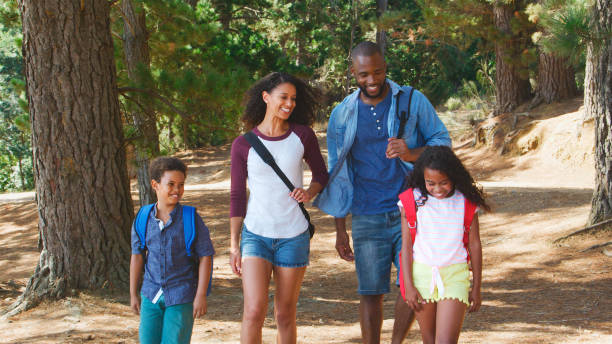 istock Family On Hiking Adventure Walking Along Path Through Woods 2205667894