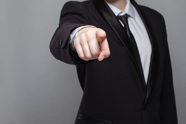 istock Businessman in black suit poingting straightforward on camera. 2205668071