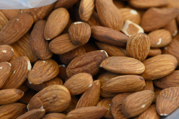 istock Almonds piled together in a rustic setting, showcasing their natural hues and textures that evoke a sense of wholesome nourishment 2205668267