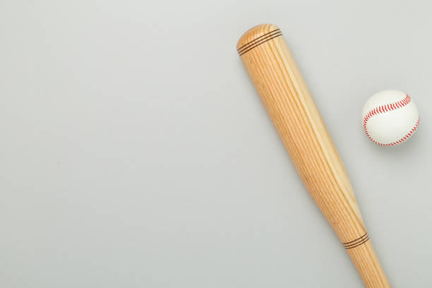 istock Wooden baseball bat on color background, top view 2205671548