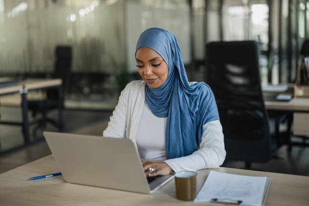 istock Young Professional Woman Working at Laptop in Office 2205673067