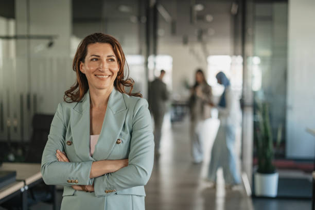 istock Professional woman smiling in modern work environment 2205673289