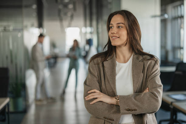 istock Young woman with relaxed pose in office 2205673589