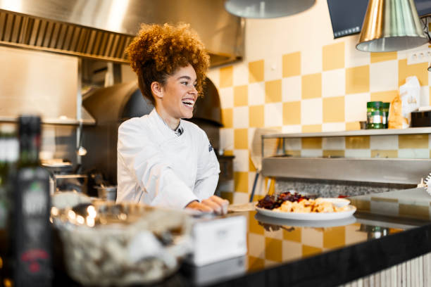 istock Professional Female Chef Holding a Beautifully Plated Dish 2205674977