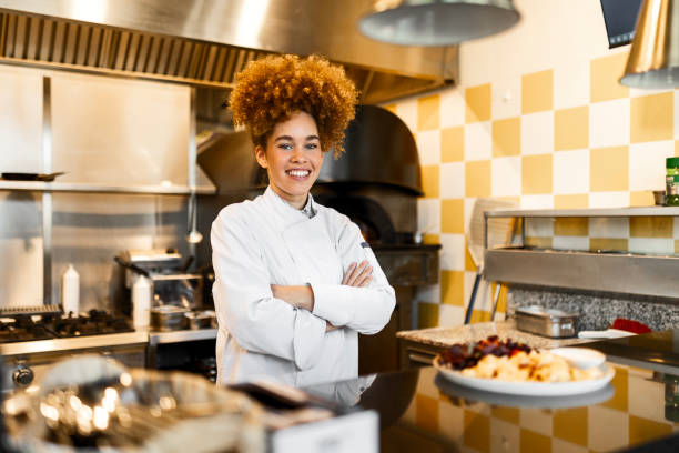 istock Talented Chef in Restaurant Kitchen Presenting a Gourmet Meal 2205675011