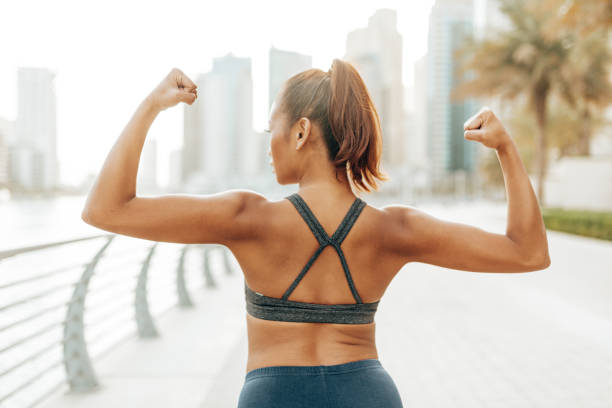 istock woman showing her muscle 2205675280
