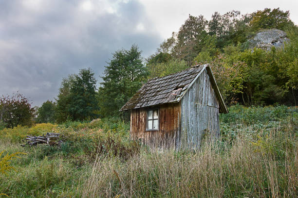 istock old wooden house in a field 2205678385