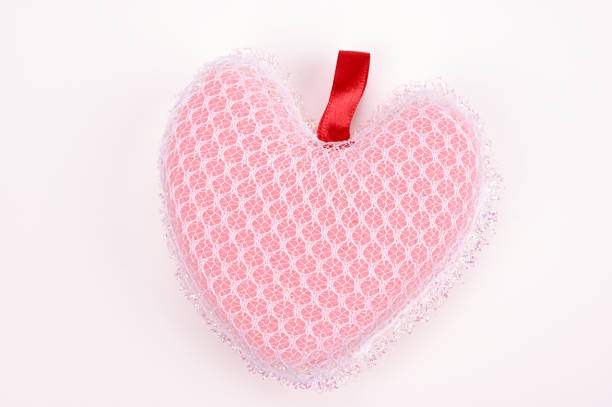 Valentine's day gift ,heart shaped cushion and hot water bottle on red background