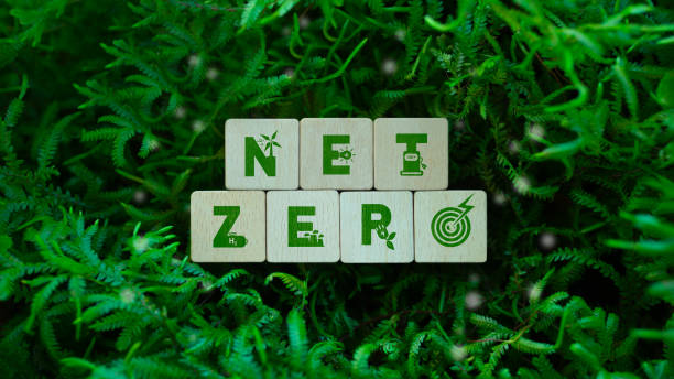 istock Net Zero Green Icon on Wooden Cube for Carbon Neutral and Zero Carbon Concept for Natural Environment. Net Zero Greenhouse Gas Emission Target, Climate Neutral Long Term Strategy for Sustainable Environment. 2205681107