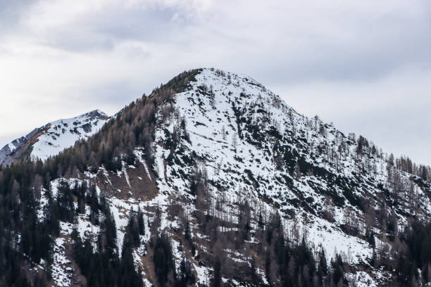 Panoramic view of the snowcapped mountain ranges of High Tauern and Nock Mountains seen from Kobesnock near Bad Bleiberg, Carinthia, Austria, Europe. Winter wonderland landscape in Austrian Alps