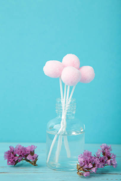 istock Air freshener on blue. White aroma diffuser bottle with sticks. Minimalism. Top view 2205688504