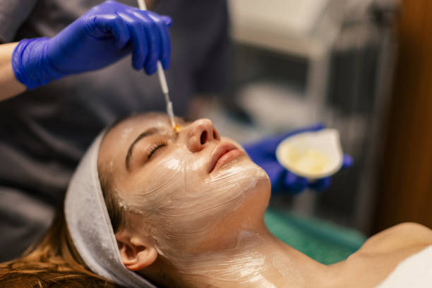 istock Young woman having a face treatment 2205689715