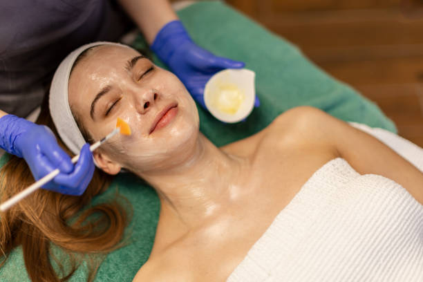 istock Young woman having a face treatment 2205689736