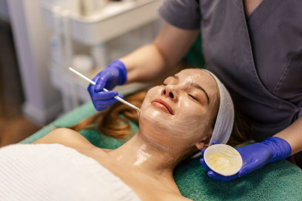 istock Young woman having a face treatment 2205689776