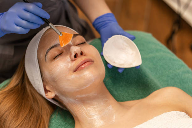 istock Young woman having a face treatment 2205689789