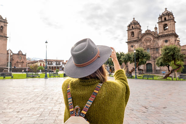 istock Tourist Capturing Historic Architecture in Sunlit Plaza 2205694854