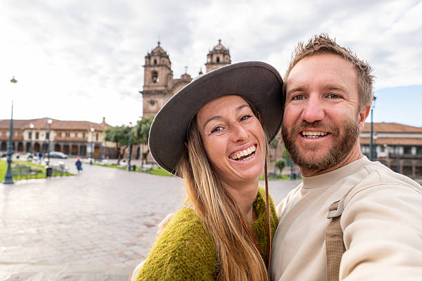 istock Happy Couple Taking a Selfie in Historic Town Square 2205694861
